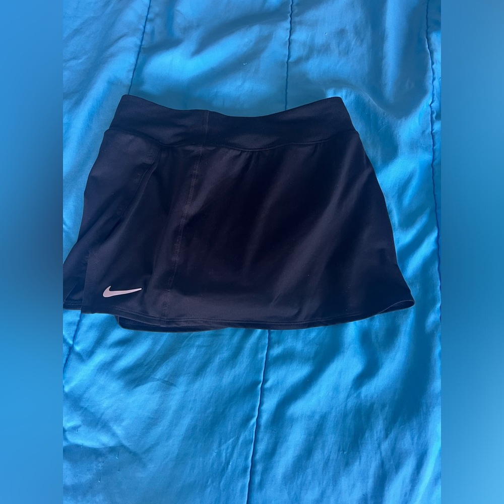 Nike women’s black Nike tennis skirt with white Nike swoosh